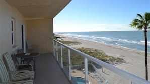 A balcony with a view of the beach and ocean. - Beachcomber unit 404 (Longboat Key)
