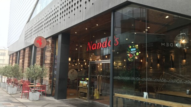 A restaurant with outdoor seating and a modern design. - Cultural quarter apartments (Leicester)