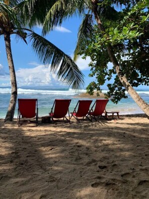 On the beach, sun-loungers, beach towels, beach bar