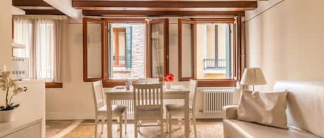 Apartment, 1 Bedroom | Living room | 21-inch flat-screen TV with digital channels, TV