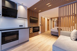 Superior Studio | Living area | 70-cm flat-screen TV with cable channels, LED TV, video game console