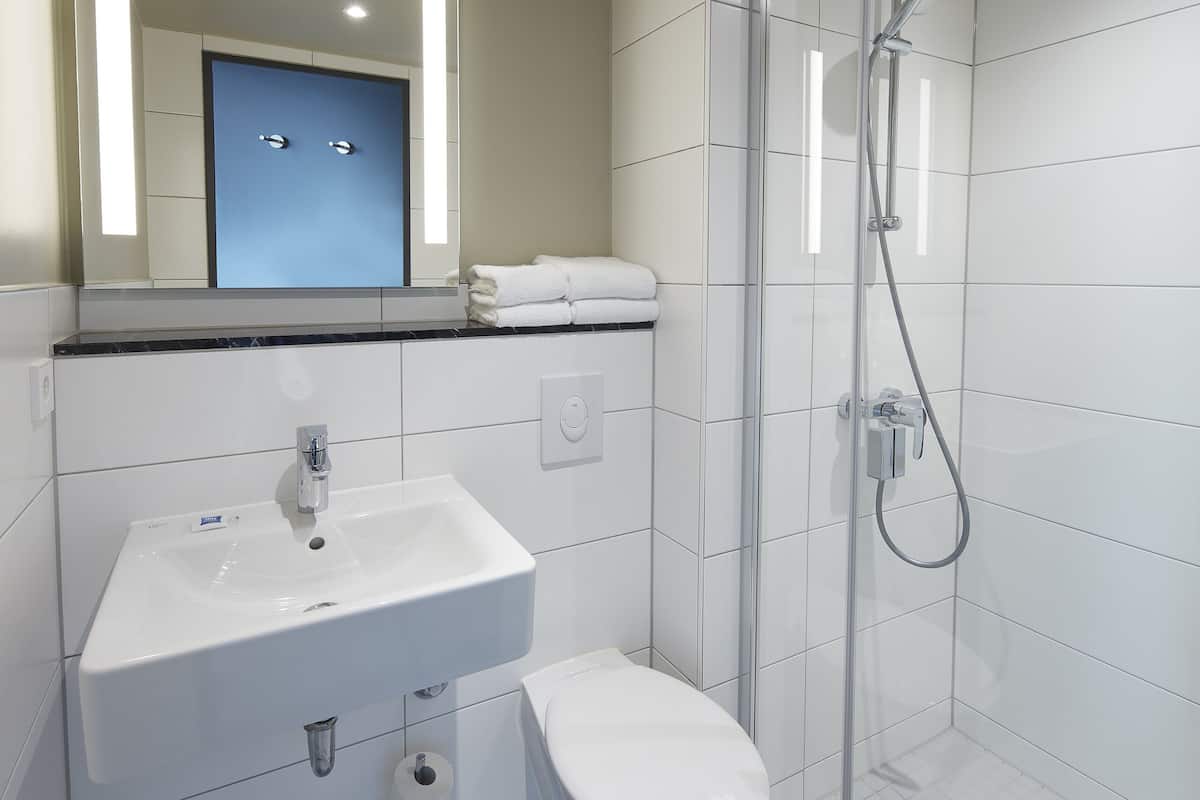 shower, eco-friendly toiletries, hair dryer, towels