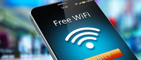 A smartphone displaying a 'Free WiFi' screen with a 'CONNECT' button.