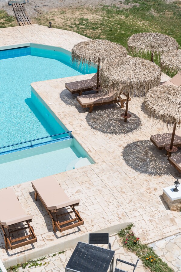Seasonal outdoor pool, pool umbrellas, pool loungers