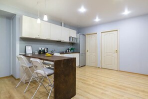 Comfort Apartment | Private kitchen | Full-sized fridge, microwave, stovetop, electric kettle