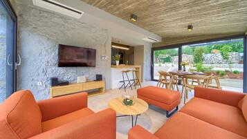 Deluxe Villa, 2 Bedrooms | Living area | Flat-screen TV