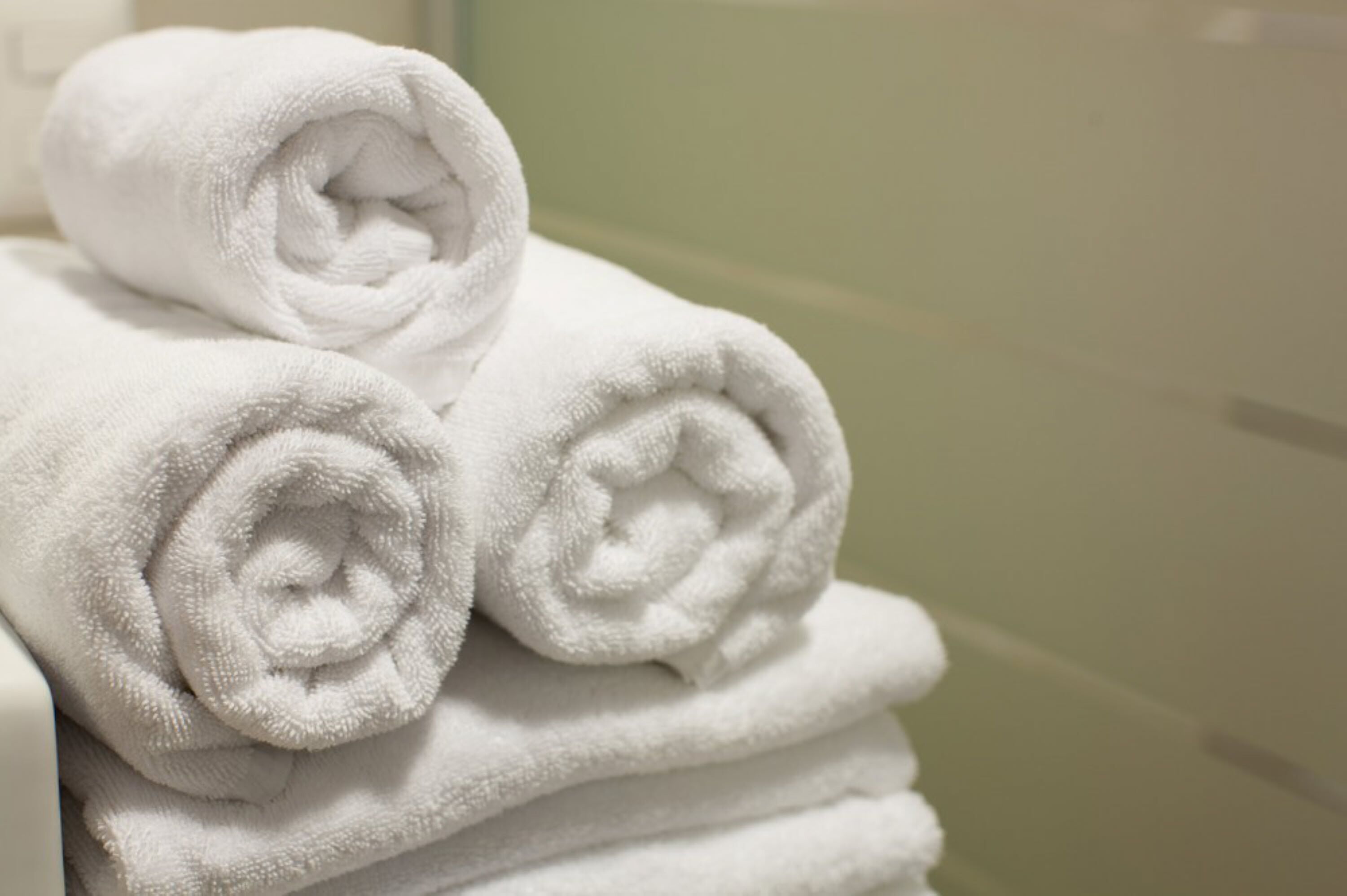 A stack of neatly folded white towels.