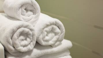 A stack of neatly folded white towels.