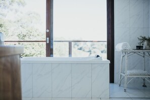Luxury House | Bathroom | Separate tub and shower, rainfall showerhead, towels, soap