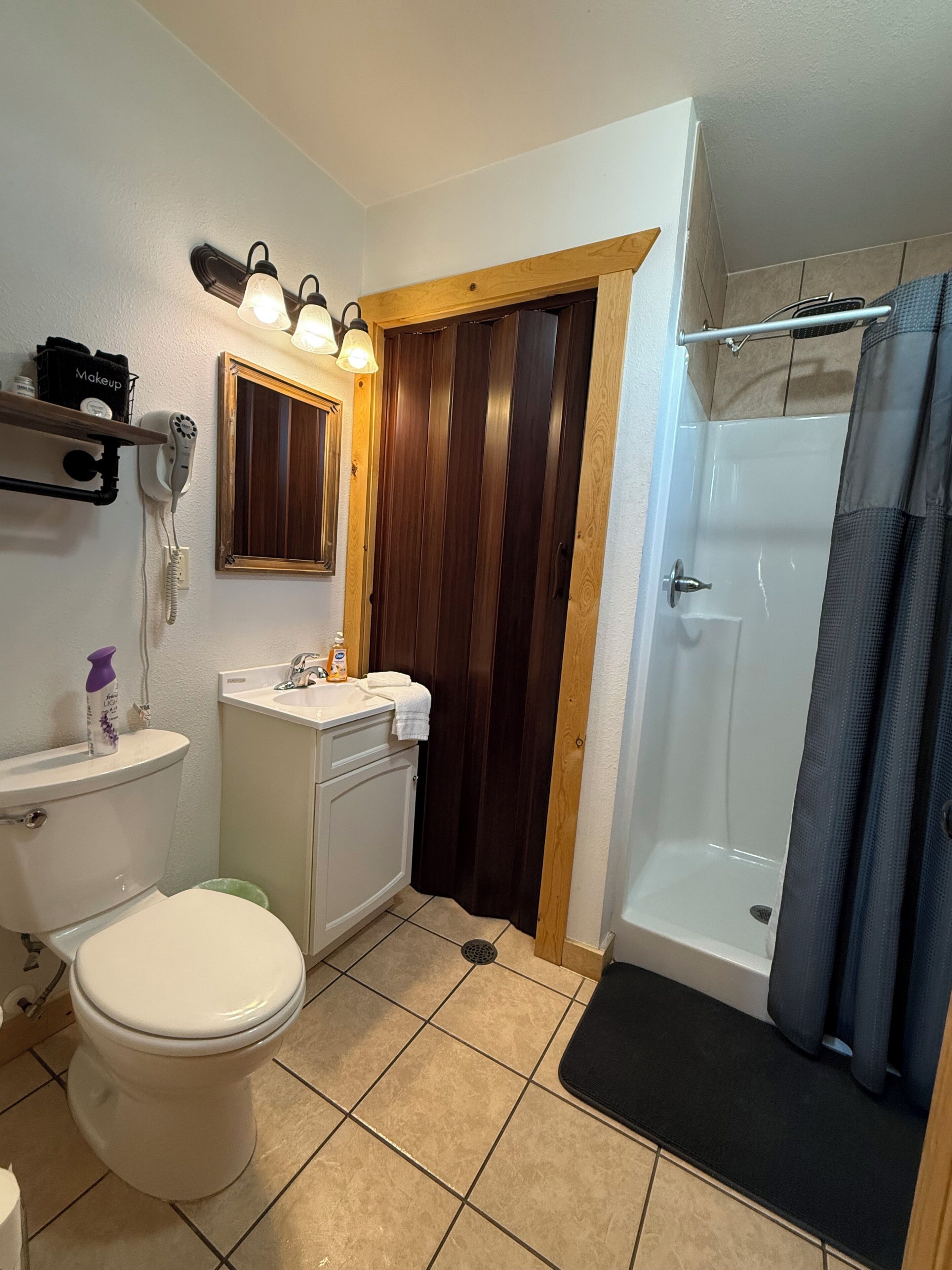 Shower, towels, soap, toilet paper