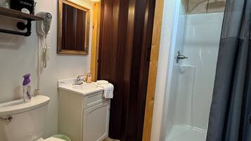 Shower, towels, soap, toilet paper