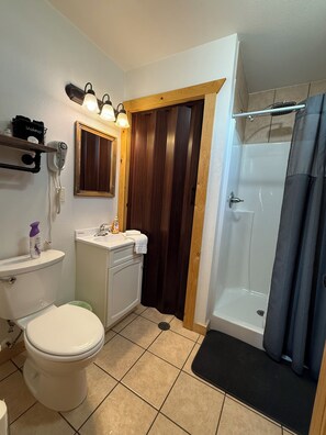 Shower, towels, soap, toilet paper