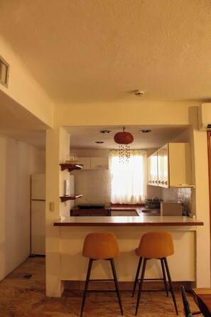 Fridge, microwave, coffee/tea maker, coffee grinder