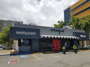 A restaurant with a 'restaurant' sign and a 'Wines' sign.
