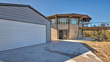Relax in a spacious two-story home with a covered patio area perfect for outdoor living.