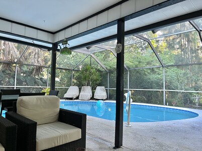 Tropical Oasis With HEATED Pool, Just minutes from the Downtown and the Beaches.