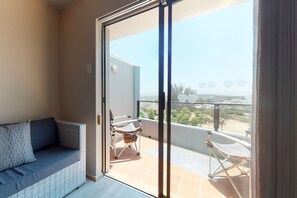 Family Apartment, 3 Bedrooms | Living area | 32-inch flat-screen TV with digital channels, TV