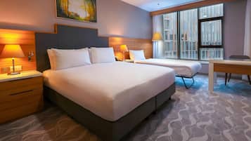 Family Room, Multiple Beds | Down comforters, minibar, in-room safe, desk