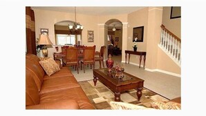 Living room - Enjoy This 6 Bedroom 4 Bath Pool Home in Windsor Hills Resort (Kissimmee)