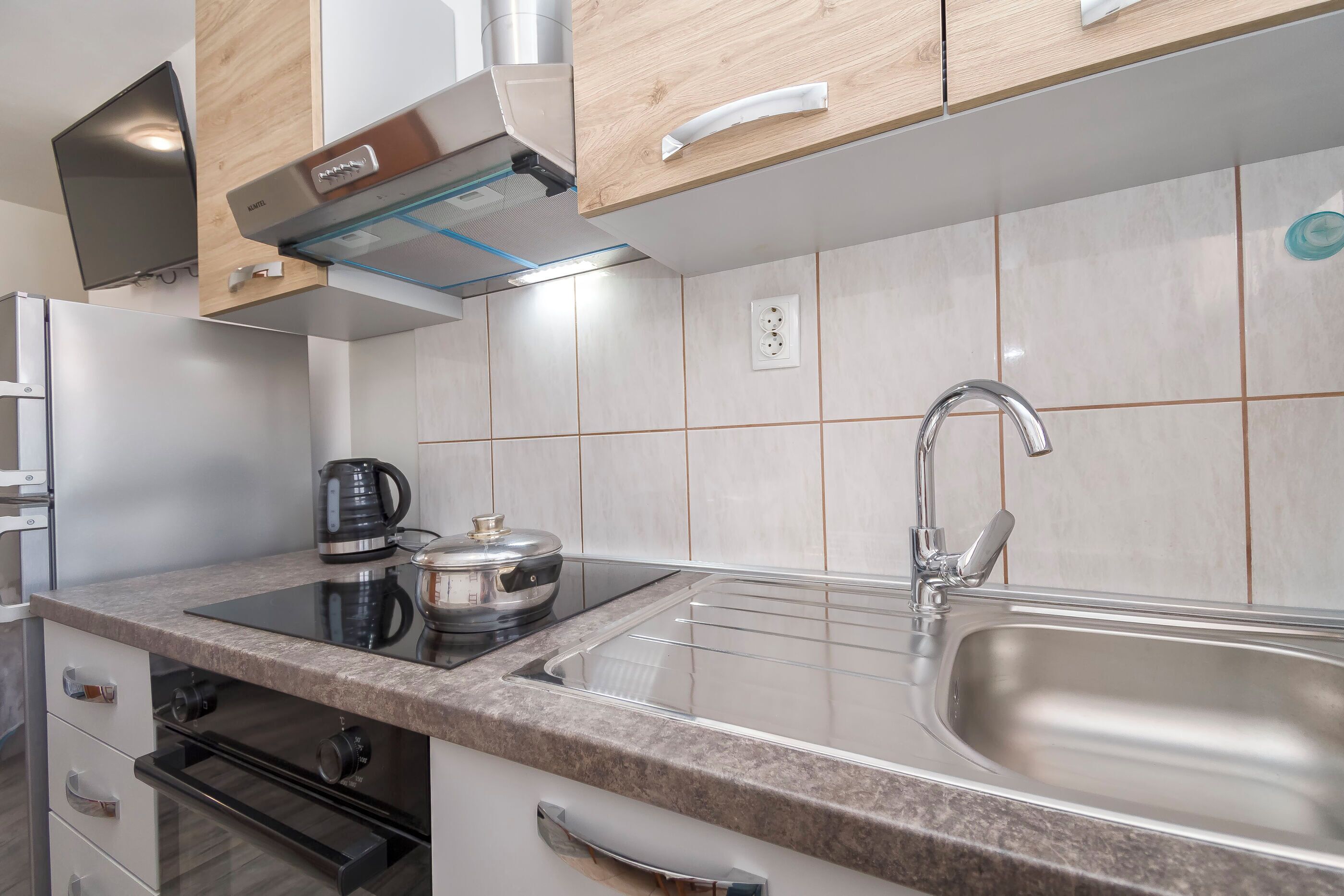Apartment (A2) | Private kitchen | Fridge, stovetop, electric kettle, cookware/dishes/utensils
