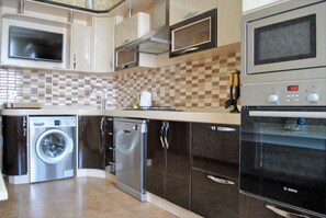 Appartement | Cuisine privée | Réfrigérateur, micro-ondes, four, plaque de cuisson