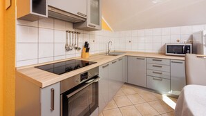 Apartment (A1) | Private kitchen | Espresso maker, fridge, microwave, oven - Apartment Davor (Dramalj)