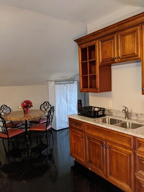 Fridge, microwave, coffee/tea maker, cookware/dishes/utensils