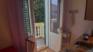 Family Apartment, 2 Bedrooms, Smoking, Kitchen | Private kitchenette | Mini-fridge, stovetop, cookware/dishes/utensils, paper towels