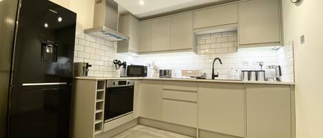 The Garden Apartment | Private kitchen | Fridge, microwave, oven, dishwasher