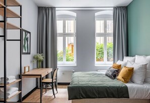 Familiesuite | Sengetøy av topp kvalitet, dundyner og safe på rommet