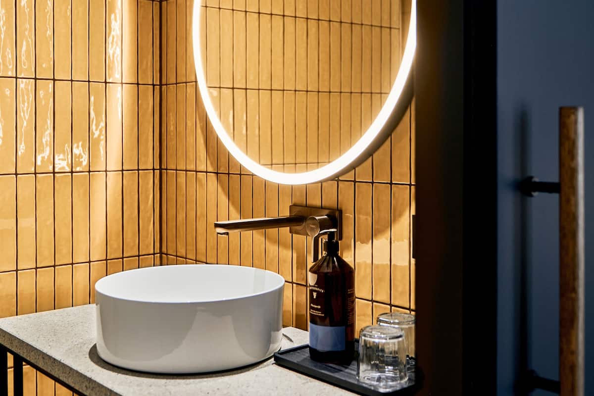 superior twin room | bathroom | shower, rainfall showerhead, eco-friendly toiletries, hair dryer