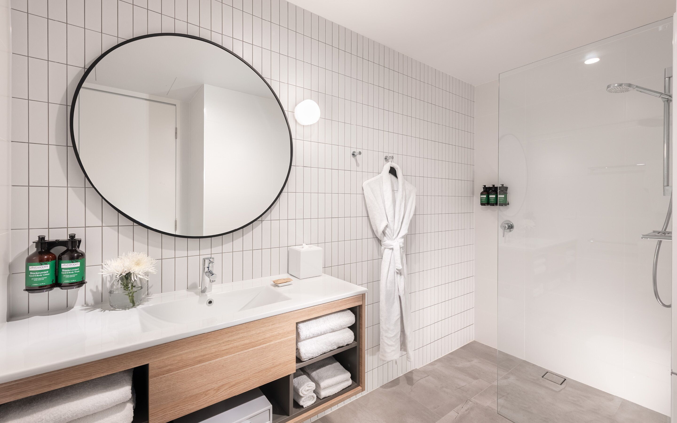 eco-friendly toiletries, hair dryer, slippers, towels