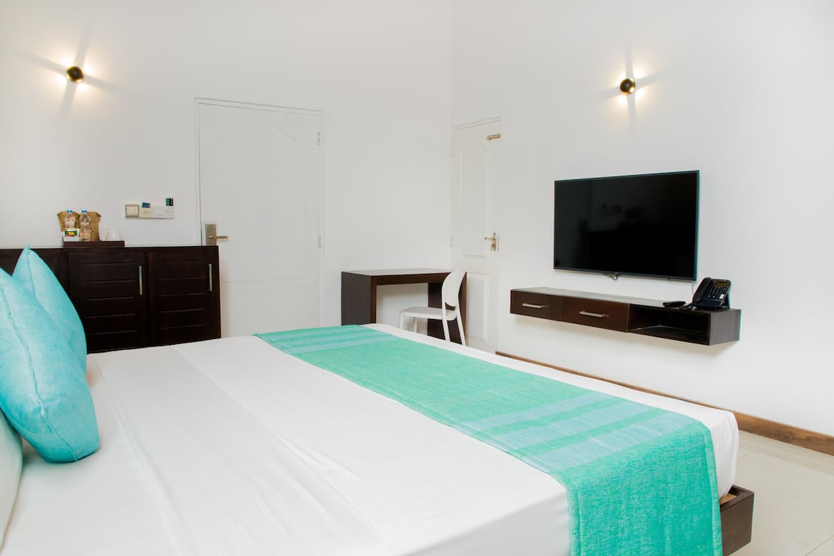 Familie appartement | Luxe beddengoed, bedden met traagschuimmatras, een minibar