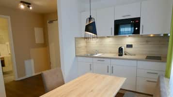 Comfort Apartment | Private kitchen | Full-sized fridge, microwave, espresso maker, coffee/tea maker