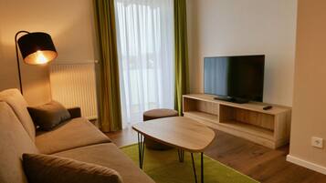 Comfort Apartment | Living area | 43-inch Smart TV with satellite channels, TV