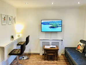 Fountain View Apartment | Living area | 50-inch flat-screen TV with satellite channels, TV - Fountain View 1BR Flat-Free Parking (Oxford)