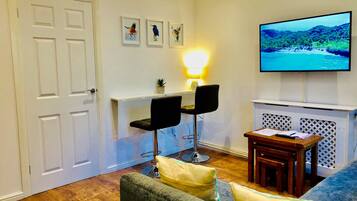 Fountain View Apartment | Living area | 50-inch flat-screen TV with satellite channels, TV