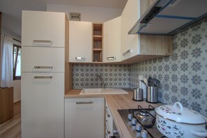Apartment | Private kitchen | Fridge, stovetop, cookware/dishes/utensils