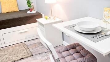 Standard Double Room | Living area | 32-inch flat-screen TV with cable channels, TV