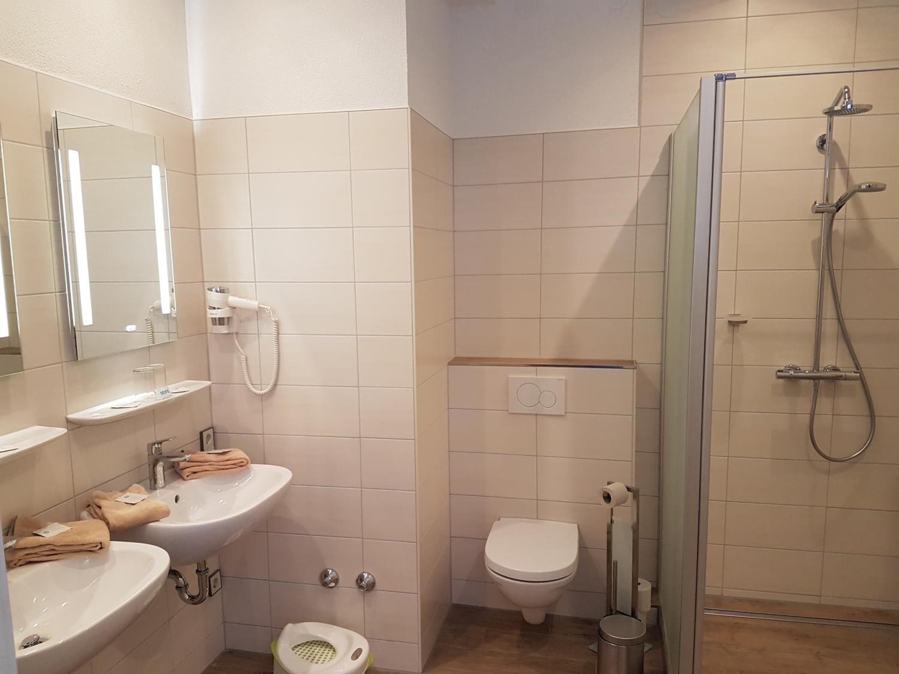 shower, rainfall showerhead, hair dryer, towels