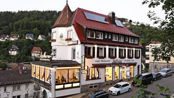 Experience the charm of this traditional European-style hotel, offering a warm welcome with large windows and a cozy atmosphere.