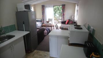 Comfort Loft | Private kitchen | Stovetop, coffee/tea maker, electric kettle, cookware/dishes/utensils