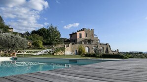 A stone building with a pool and wooden deck. - Torresassa, Montaione, Florence and Chianti (Montaione)