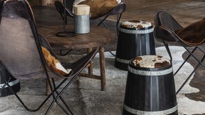 A bar area with wooden furniture, stools, and a neon sign. - Siggesta Gård (Värmdö)