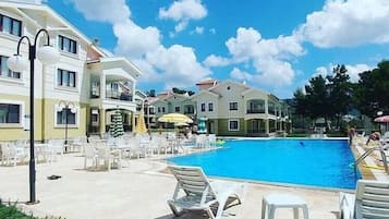 Outdoor pool, pool umbrellas, pool loungers