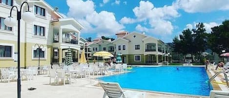 Outdoor pool, pool umbrellas, pool loungers