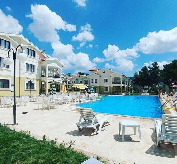 Outdoor pool, pool umbrellas, pool loungers
