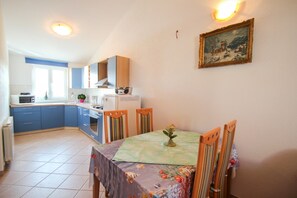 Apartment, 2 Bedrooms | Living area | Flat-screen TV