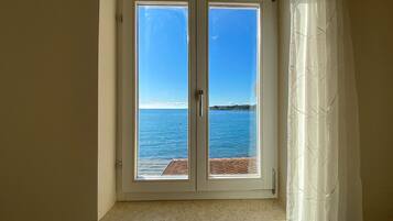 Apartment, Sea View (2) | Living area | Flat-screen TV
