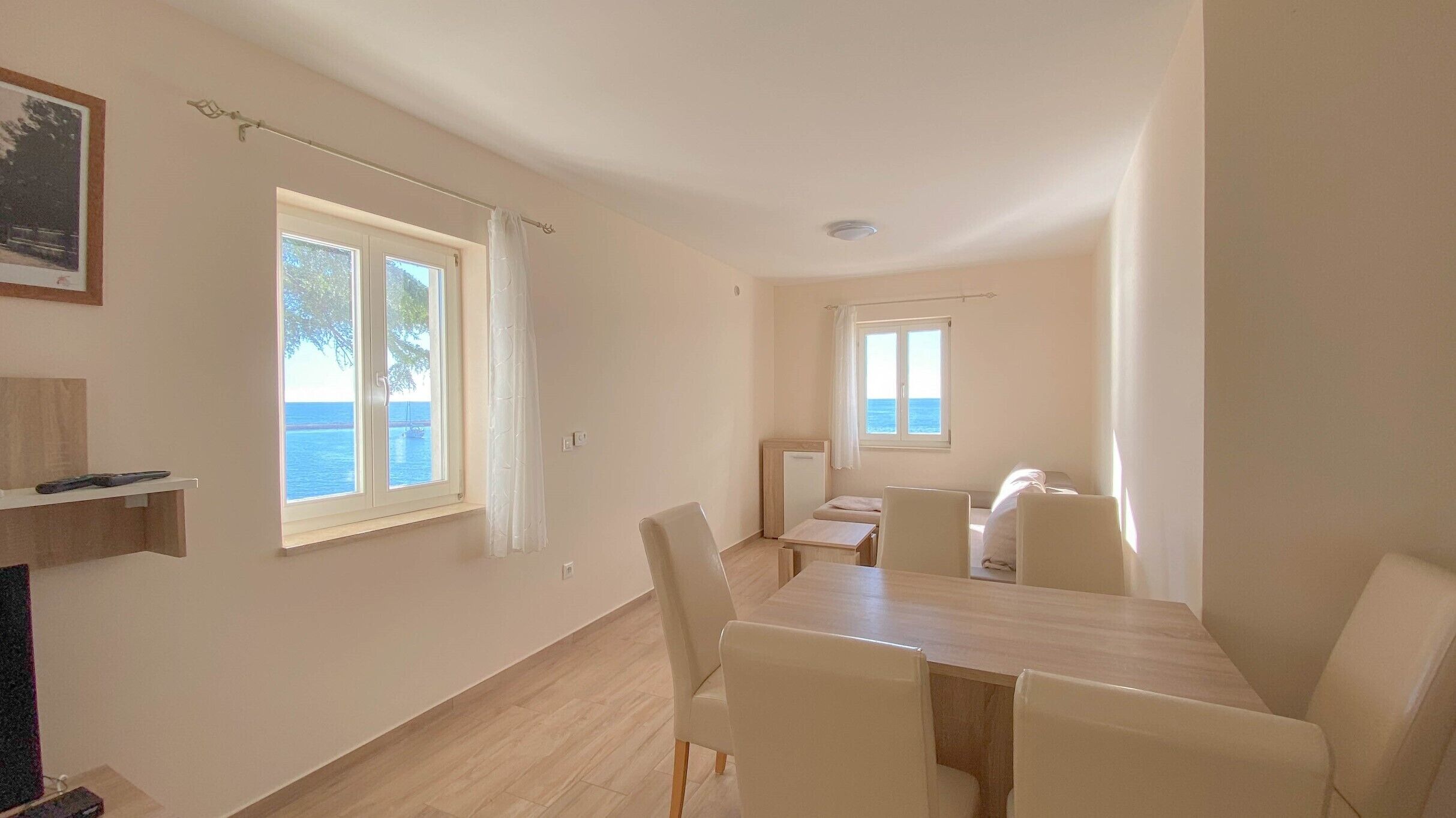 Apartment, Sea View (A4+2) | Living area | Flat-screen TV